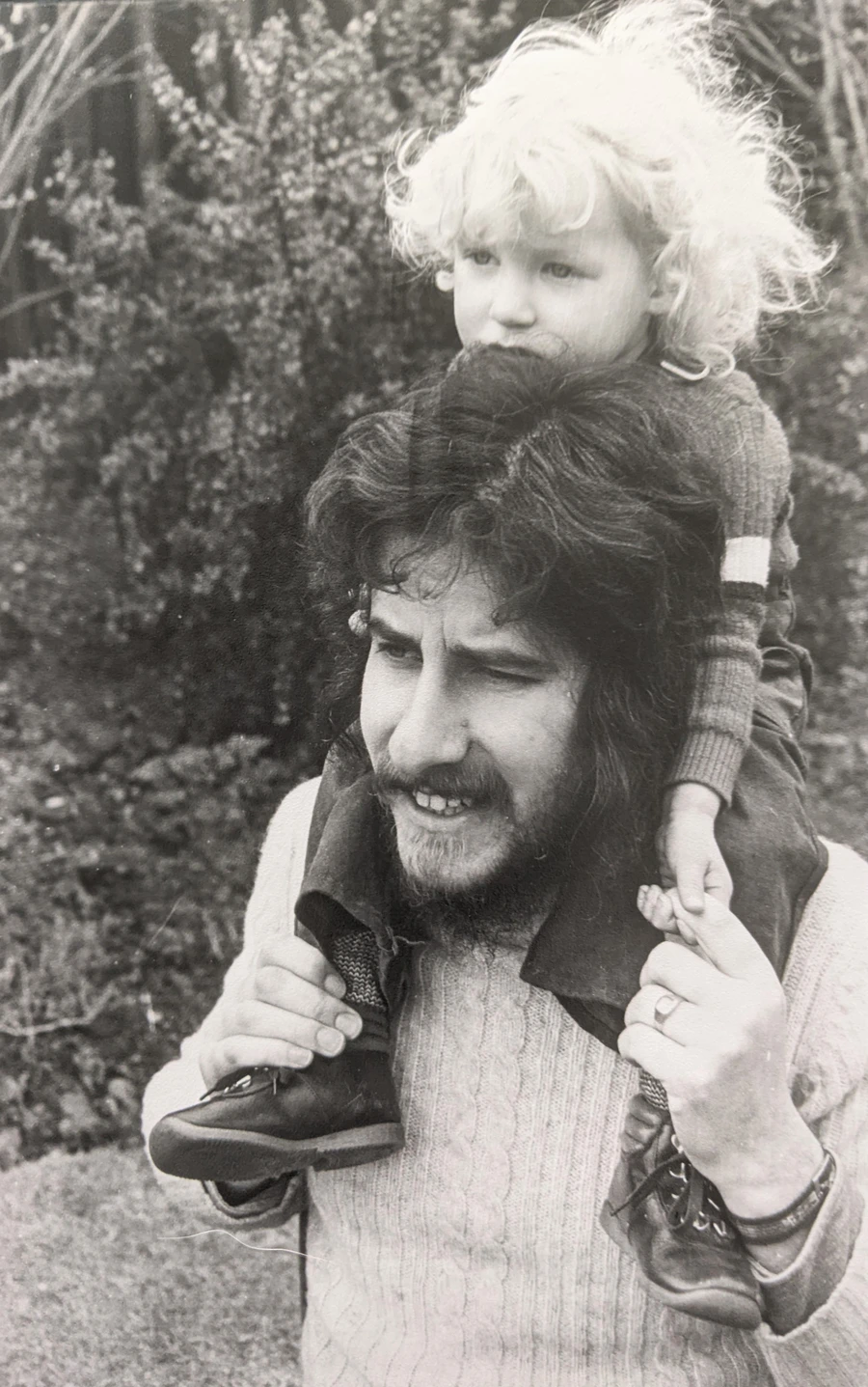 photograph of a child on her dad's shoulders