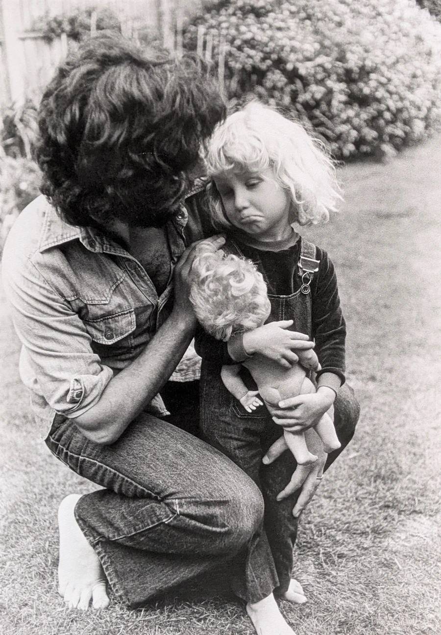 photograph of a child and her dad